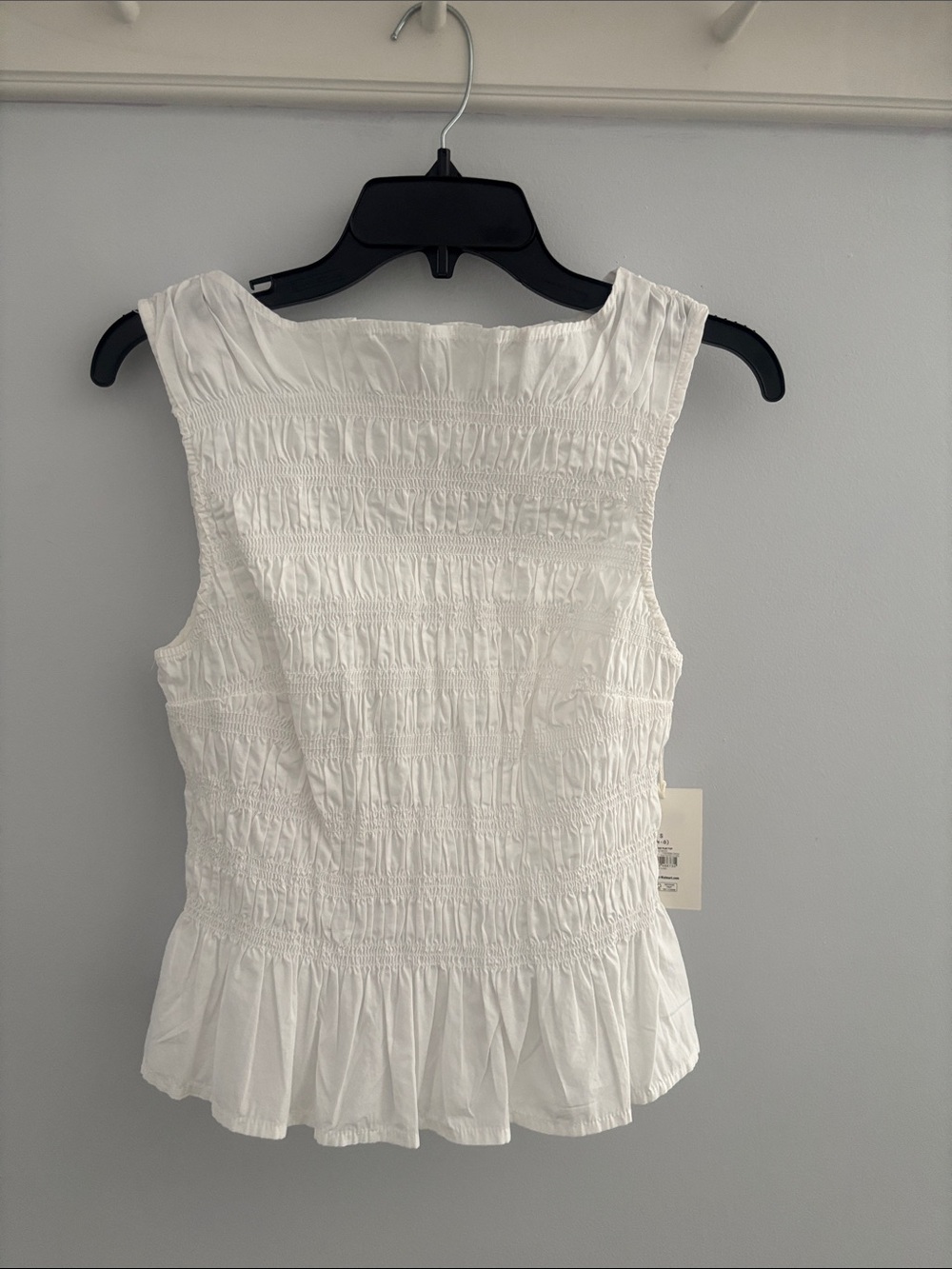 Smocked White Sleeveless Peplum Camisole